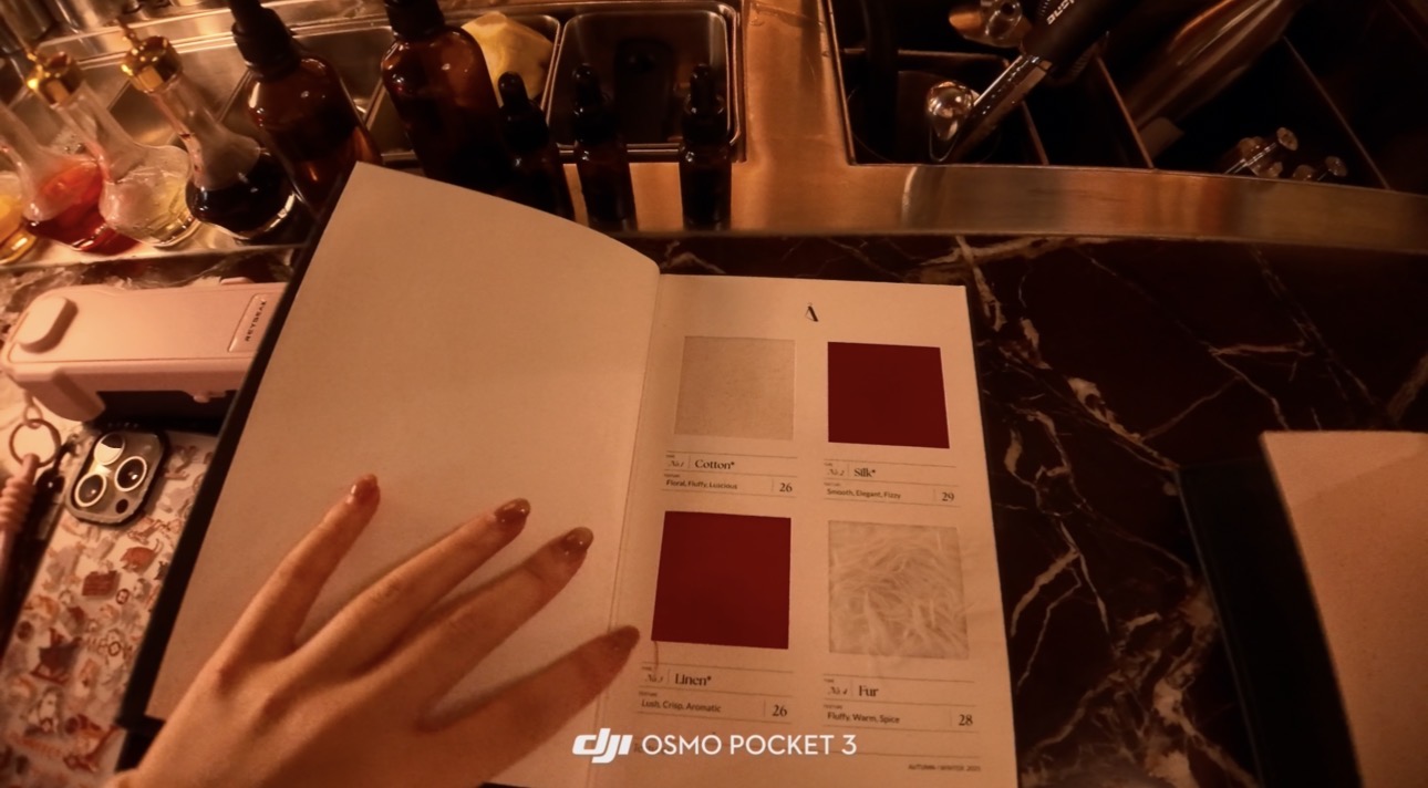 Tailor Room cocktail menu opened to fabric swatches