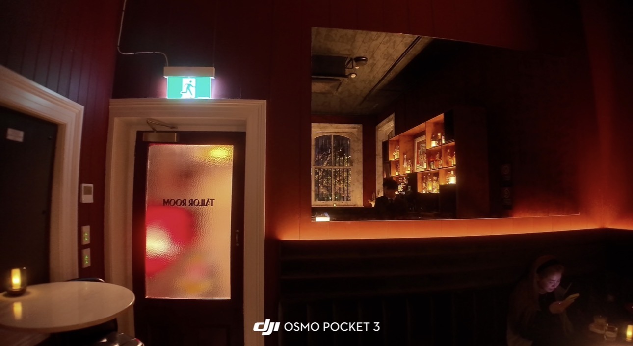 Tailor Room doorway and dark red interior lighting