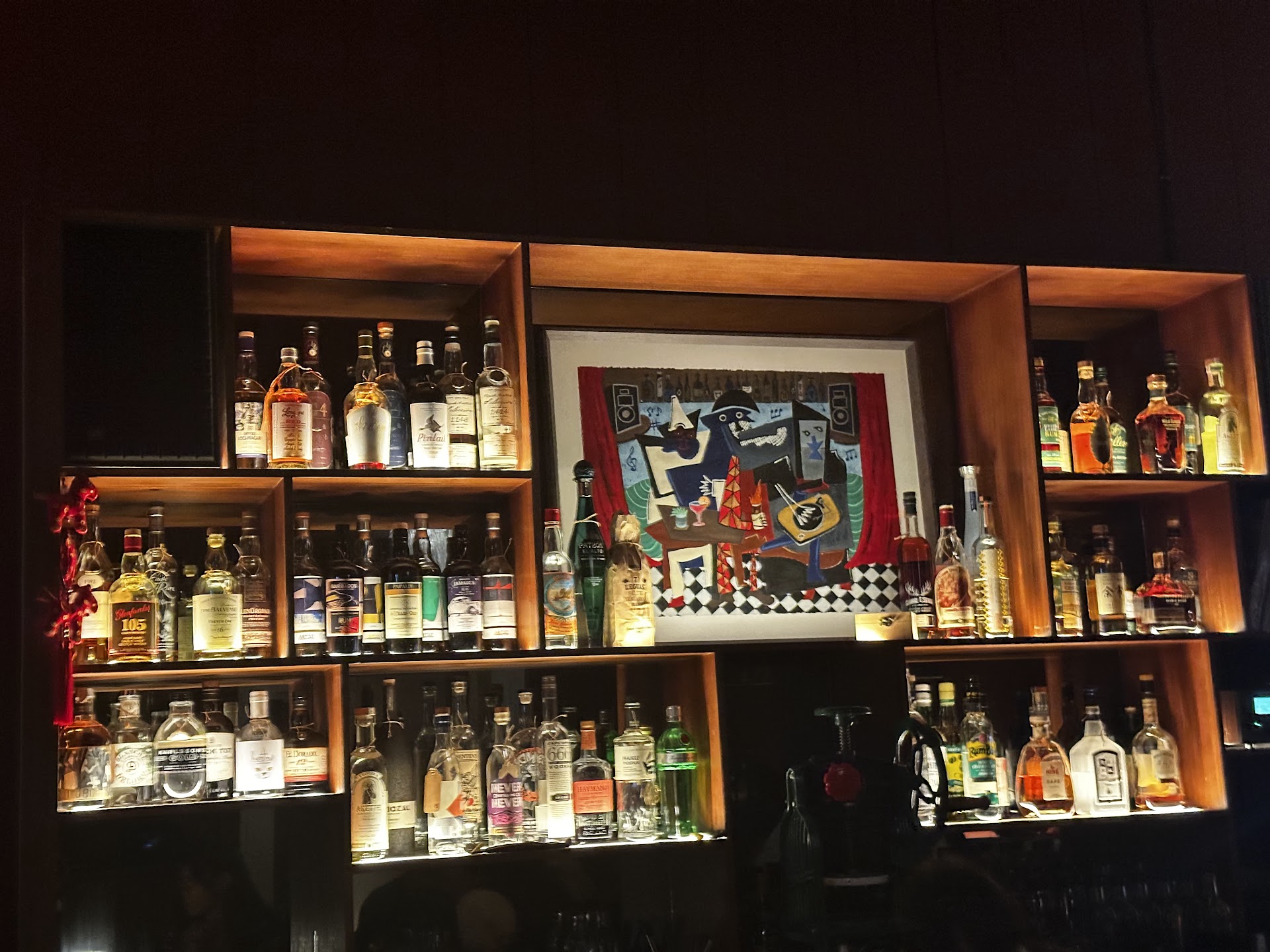 Tailor Room backbar shelves glowing with warm amber light